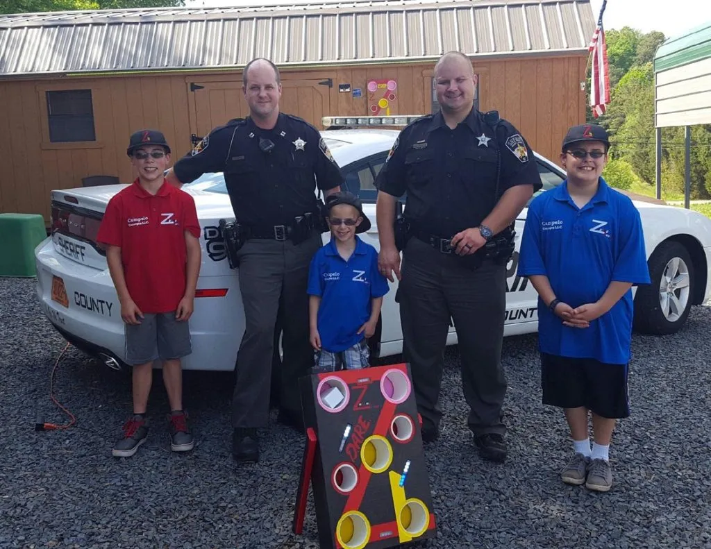 Police officers playing ZagBag Board